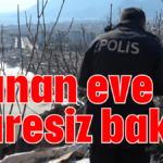 Yanan eve çaresiz bakış