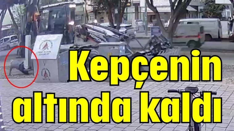 Kepçenin altında kaldı