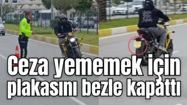 Antalya'da ceza yememek için plakasını bezle kapattı